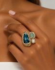 Sassy Jones Zahara Sparkle Ring featuring mixed green stones, a luminous pearl accent and Gold tone finish detailing.