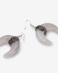 Natural shell crescent earrings with translucent ivory and gray marbling and crystal embellished accents.