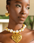 Model wearing Amora Chunky Pearl Heart Chain with matching earrings – Sassy Jones jewelry.