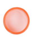 Chunky coral orange resin bangle bracelet with glossy translucent marbling on a white background.