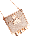 Luxury red lipstick trio with three velvety matte red shades and glittering gold clutch case with chain strap