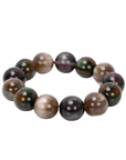 Oversized marbled stretch bracelet with glossy resin beads in olive, caramel, espresso, and smoky plum tones on a white background.