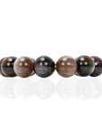 Oversized marbled stretch bracelet with glossy resin beads in olive, caramel, espresso, and smoky plum tones on a white background.