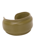 Olive green padded vegan leather cuff bracelet with tonal stitching detail on a clean white background.