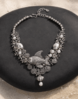 Paloma silver angelfish statement bib necklace featuring sculpted fish, pearl accents, coral inspired details and dimensional silver tone sea motifs.