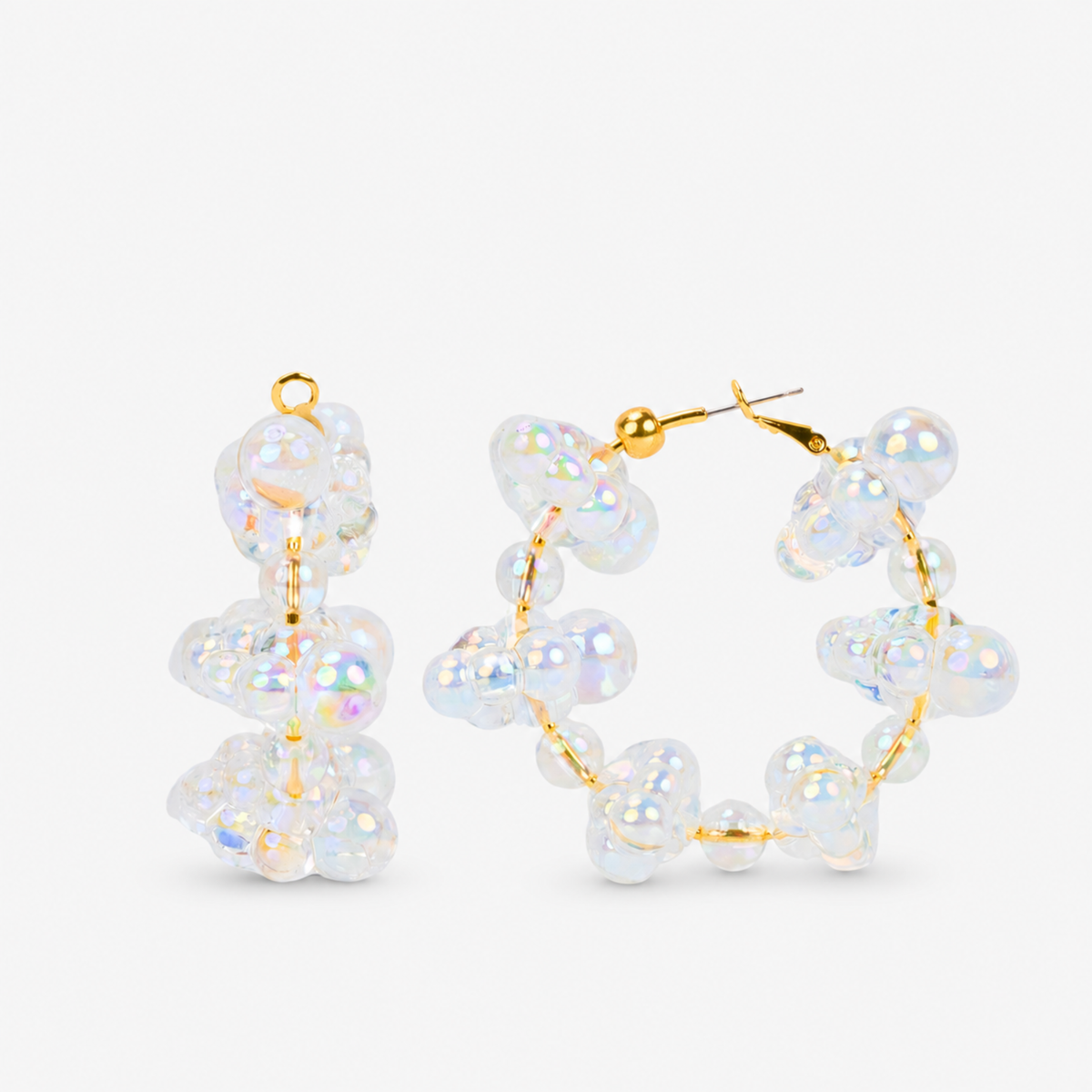 Iridescent statement hoop earrings featuring dimensional clear bubble beads and delicate gold details.