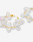 Large bubble hoop earrings with translucent dimensional beads and soft multicolor iridescent shine.