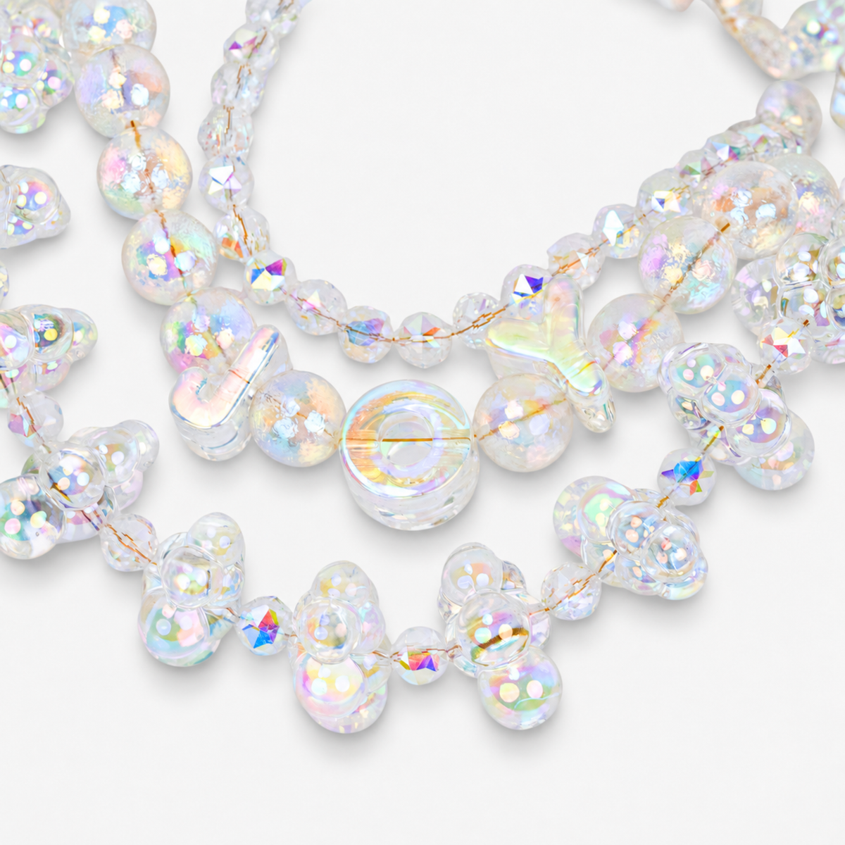 Alana Cloud Bubble Chain featuring layered strands of translucent iridescent bubble beads with multicolor reflective shine.