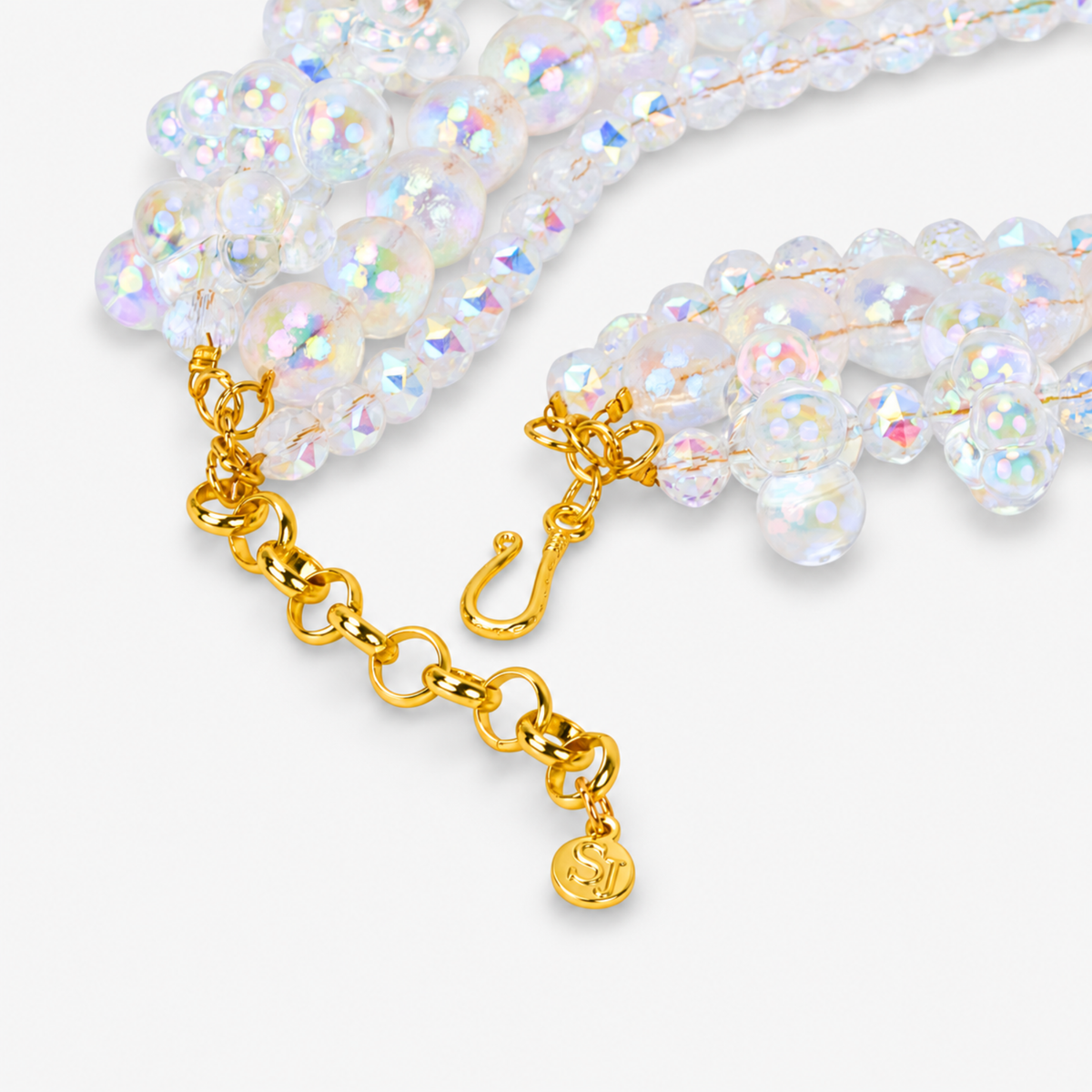 Alana Cloud necklace featuring multiple strands of translucent bubble shapes with rainbow iridescent reflections.