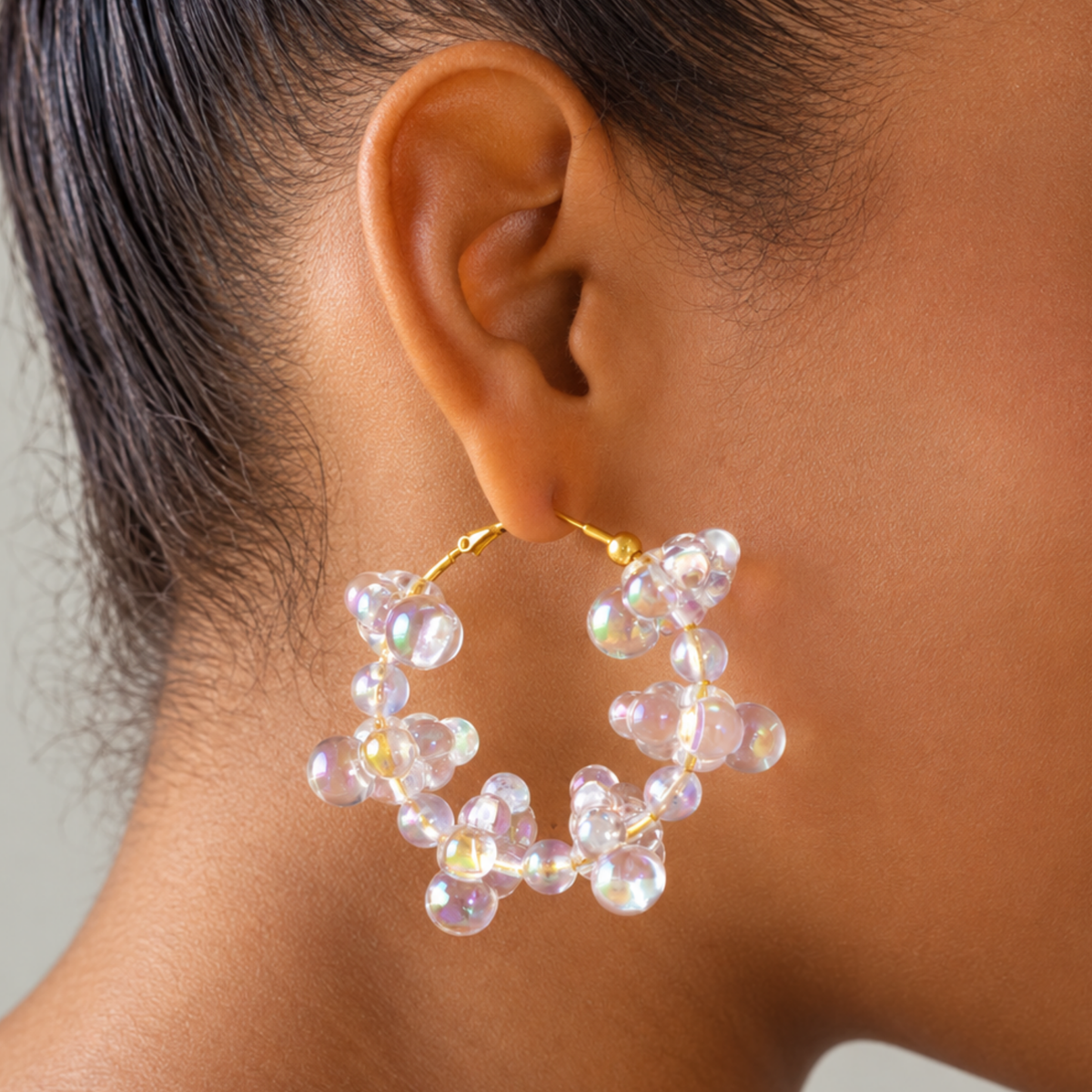 Sassy Jones Alana Cloud earrings featuring playful iridescent bubble clusters arranged around oversized hoops.