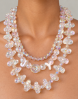 Sassy Jones Alana Cloud Bubble Chain featuring clear dimensional beads reflecting pink, lavender, blue and gold tones.
