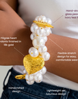Ivory pearl stretch bracelet featuring dimensional pearl clusters and sculpted hearts with Gold tone finish.