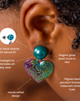 Rainbow heart dangle earring featuring a deep teal glass pearl top and multicolor iridescent finish.