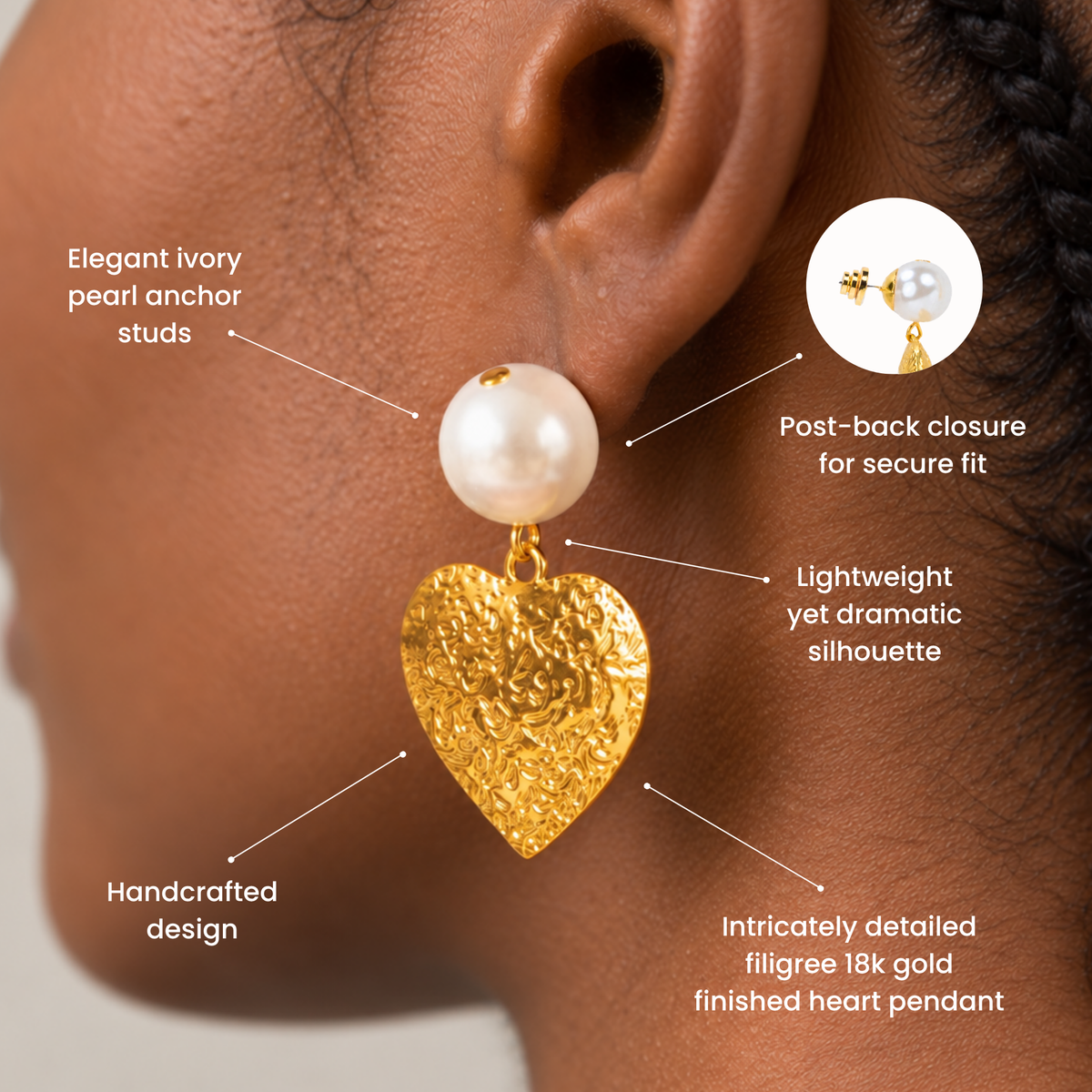 Ivory pearl statement earrings featuring dangling gold hearts with intricate embossed floral detailing.
