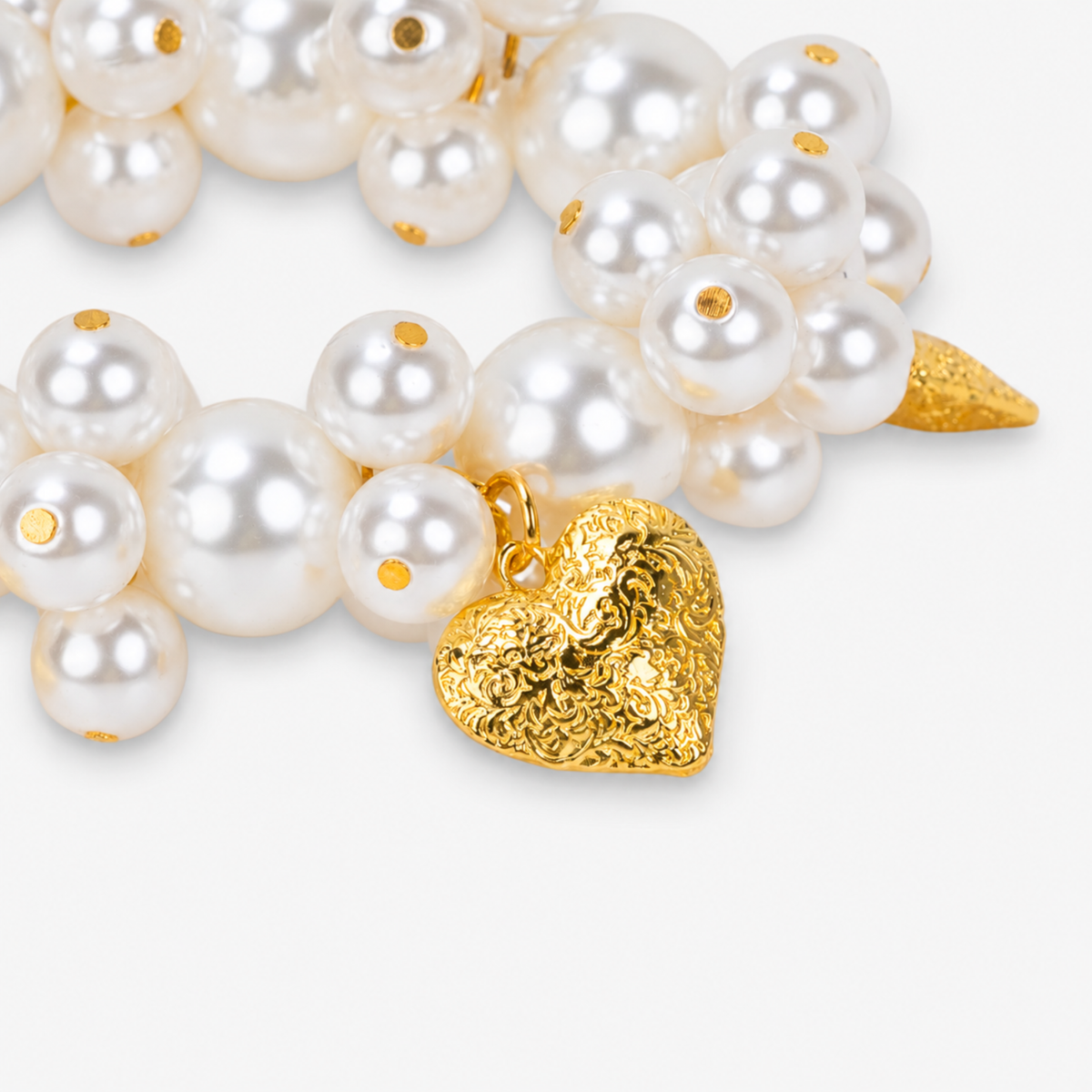 Chunky ivory pearl statement bracelet featuring textured heart charms with a polished Gold tone finish.
