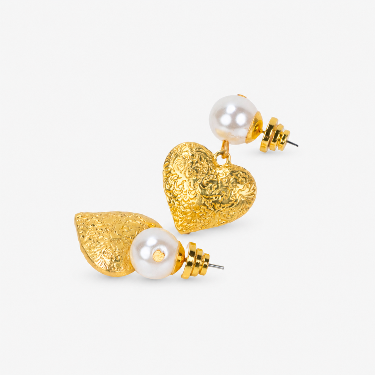 On model view of Amora Pearl Heart Dangle Earring featuring a luminous ivory pearl and sculptural gold heart.
