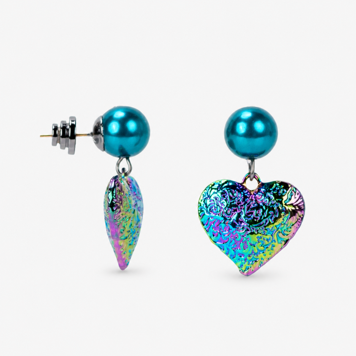 Sassy Jones Amora Rainbow Teal earrings featuring sculptural heart pendants in teal, pink, green, purple and gold hues.
Colorful heart statement earrings with glossy teal glass pearl studs and textured iridescent rainbow drops.
