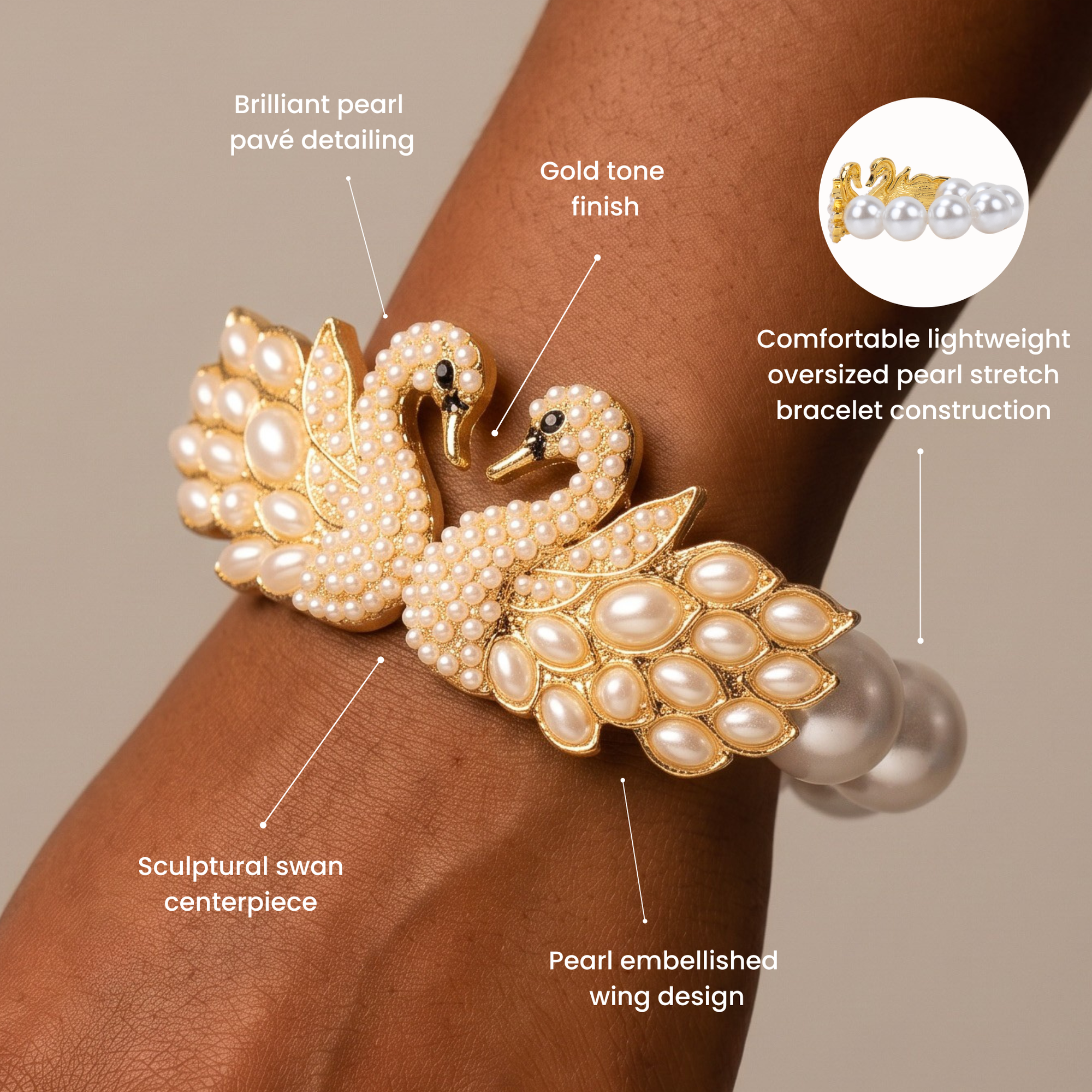 Ornate gold tone swan bracelet embellished with pavé crystals, ivory pearls, and an elegant double swan centerpiece.