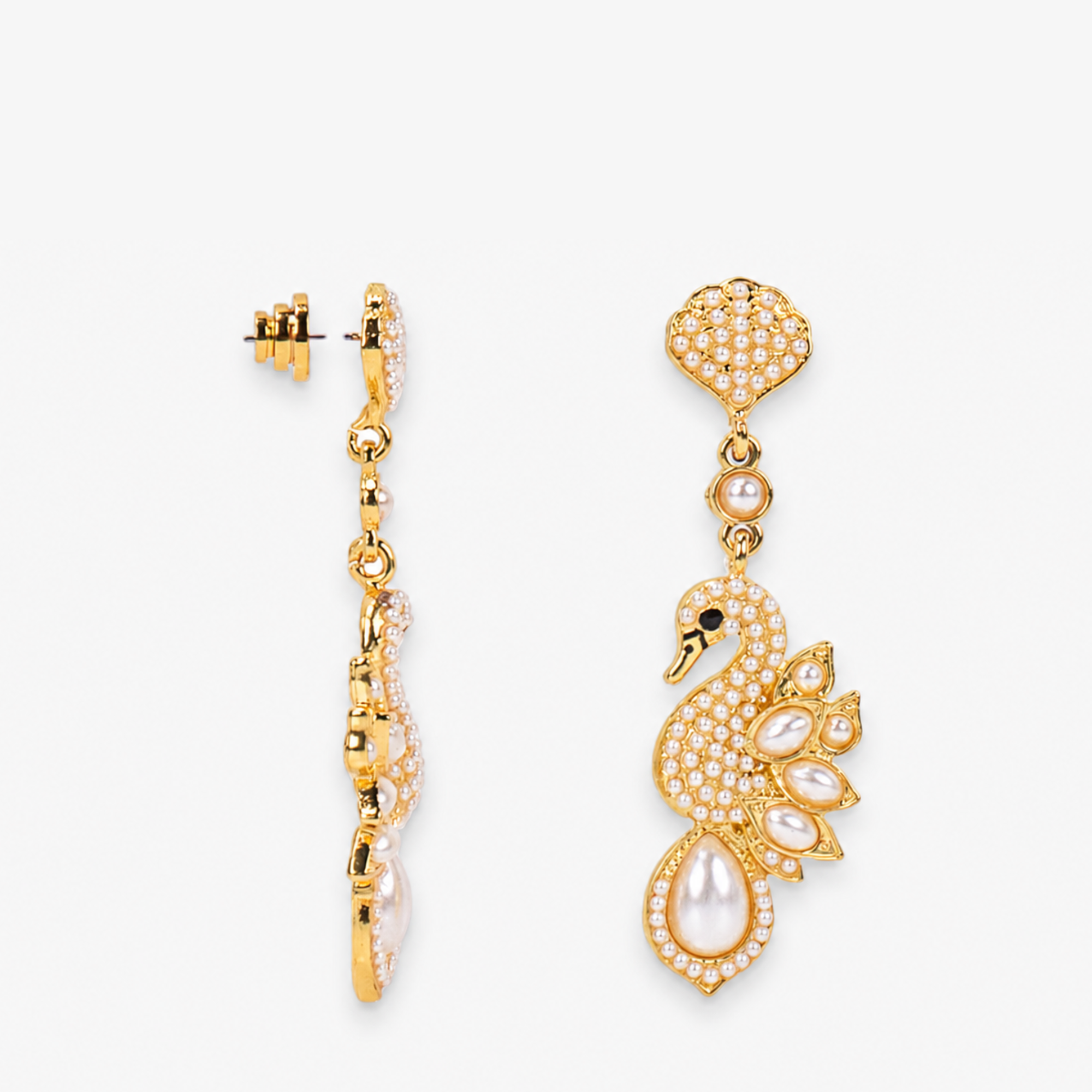 Gold swan statement earrings with pavé crystal detailing, luminous pearl feathers, and elegant pearl drops