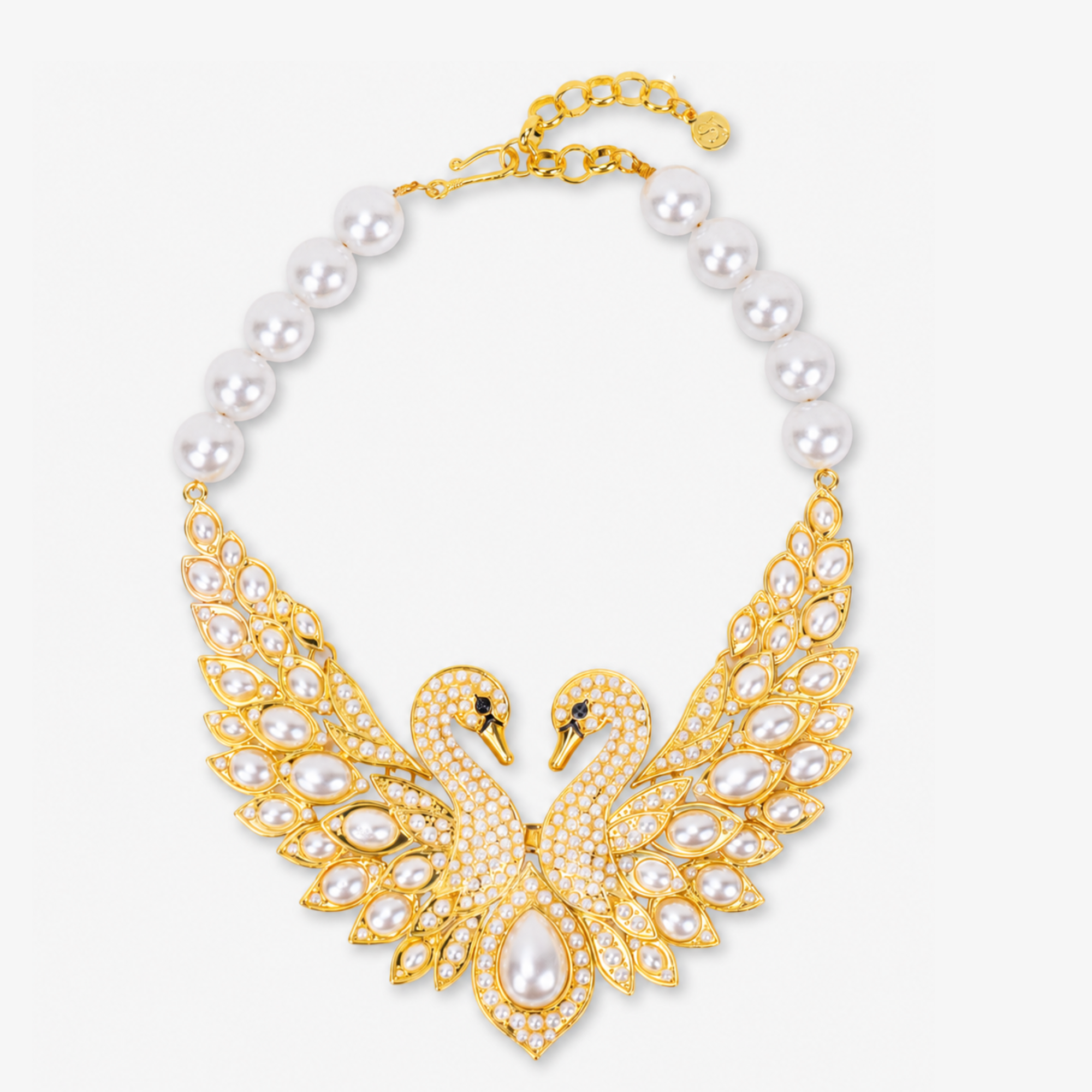 Anastasia Swan Statement Hinge Bib featuring two crystal encrusted gold swans, luminous pearl details, and dramatic outstretched wings.