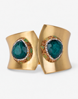 Armana Statement Hinge Cuff in Emerald featuring green stone centerpieces and a sculptural Gold tone finish.