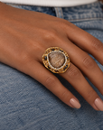 Sassy Jones Armana Black ring featuring a textured black stone in a dimensional embellished setting.