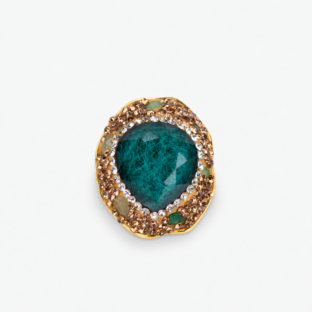 Armana Statement Ring in Emerald featuring an oversized green stone centerpiece with sparkling crystal accents.