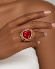 Sassy Jones Armana Red ring featuring a vivid red stone centerpiece in a dimensional embellished setting.