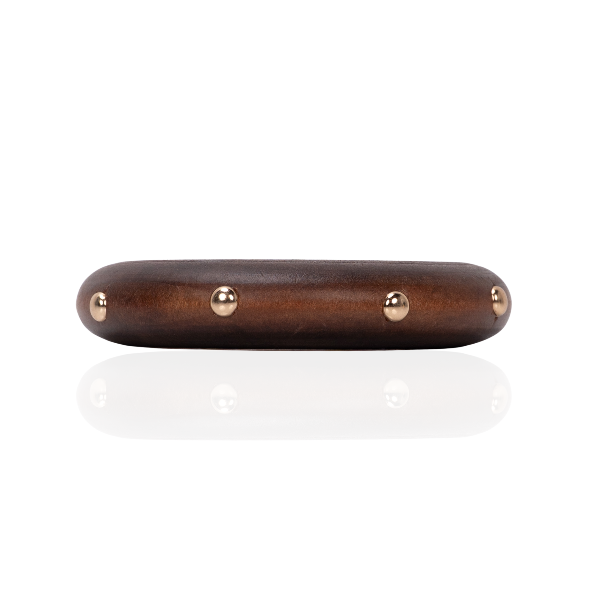 Rounded espresso brown statement bangle bracelet with polished gold stud accents and smooth sculptural silhouette by Sassy Jones.