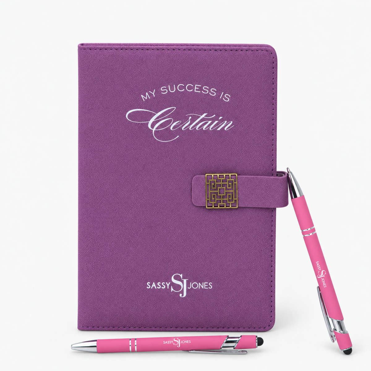  Bloom &amp; Believe Trio featuring a purple Sassy Jones affirmation journal and two pink branded pens.