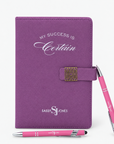  Bloom & Believe Trio featuring a purple Sassy Jones affirmation journal and two pink branded pens.