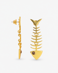 Close up of Caicos 18K Fishbone Dangles showing sculptural ribbed detailing, articulated construction and crystal eye accents.  Sassy Jones Caicos statement earrings featuring polished gold plated fishbone shapes designed with dimensional linked sections.
