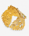 Calypso Palm Crystal Adjustable Cuff featuring a sculptural gold palm leaf covered in clear crystals and iridescent stones.
