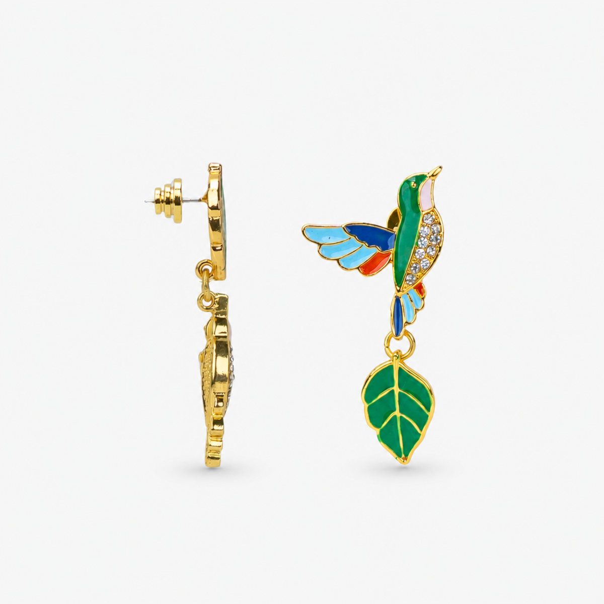 Asymmetrical botanical earrings featuring one hummingbird above a leaf and one green leaf above a hummingbird.
