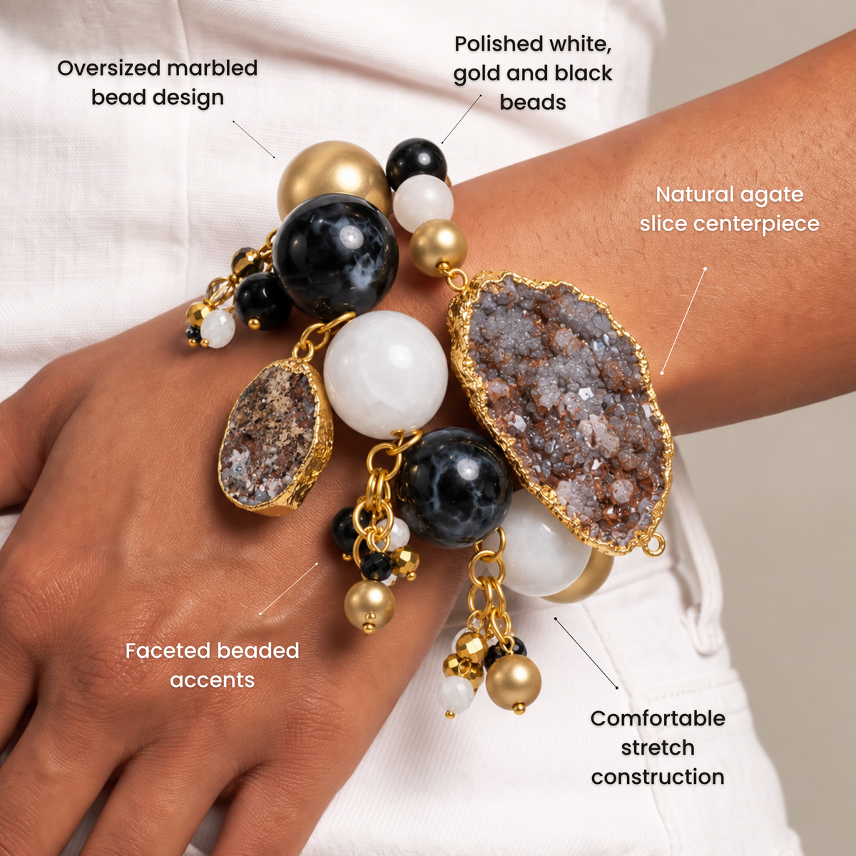 Black and gold statement bracelet featuring chunky round beads, natural agate, and dangling bead clusters.