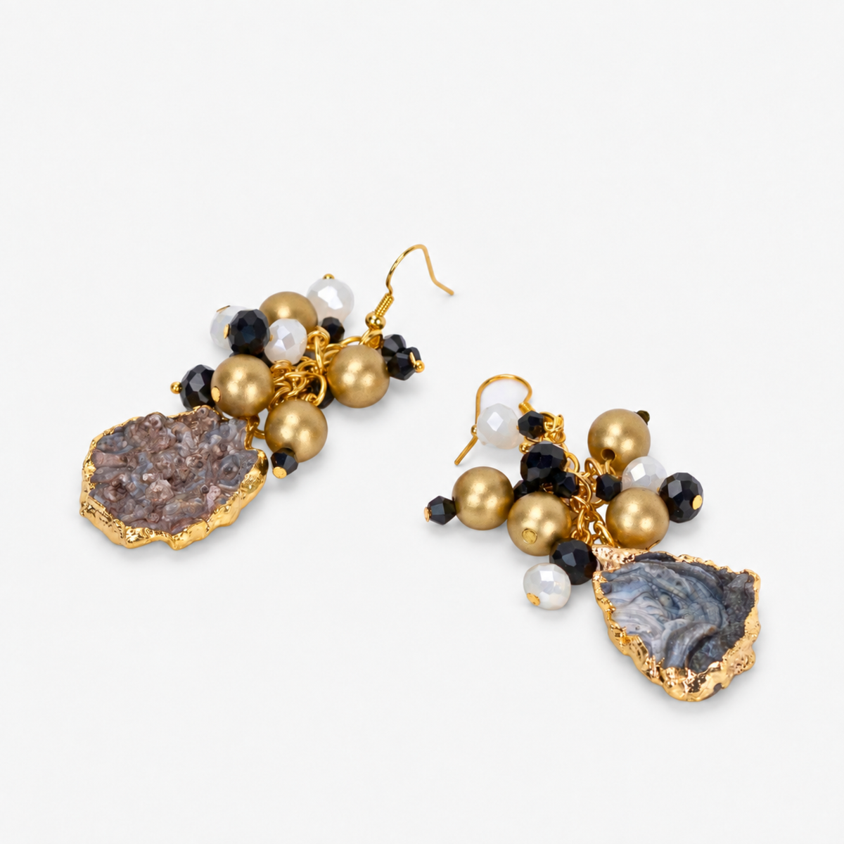 Black and gold statement earrings featuring natural sliced agate drops and faceted bead clusters.