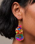 Multicolor statement earrings with raw agate drops, faceted rainbow beads, and gold details.