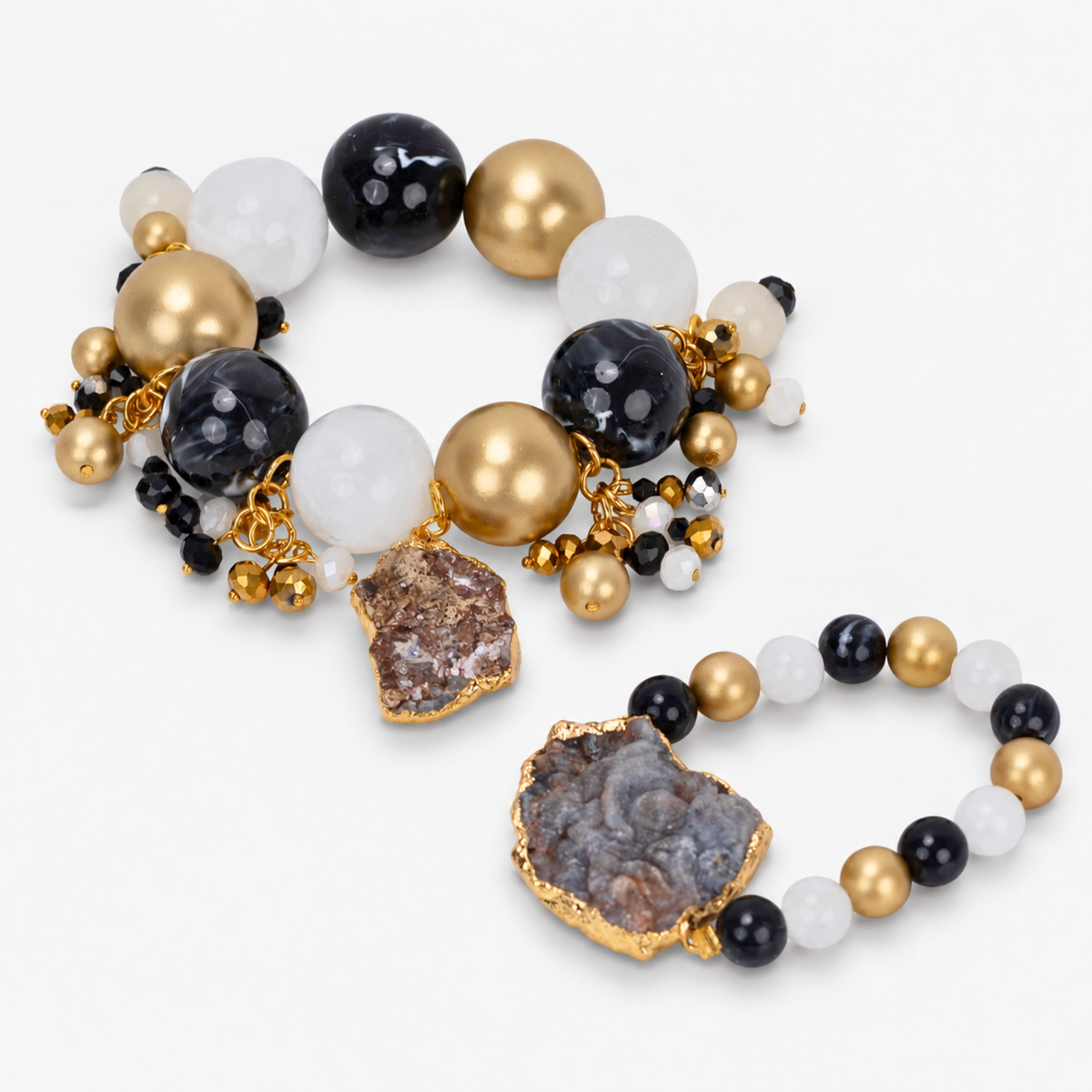 Black and gold statement bracelet featuring chunky round beads, natural agate, and dangling bead clusters.