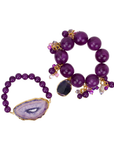 Three piece stretch bracelet stack featuring genuine purple agate beads, a natural druzy agate slice, crystal charms, gemstone accents, and gold detailing.