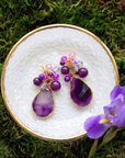 Statement dangle earrings featuring genuine purple agate slices, grape agate beads, faceted crystal accents, and gold detailing.