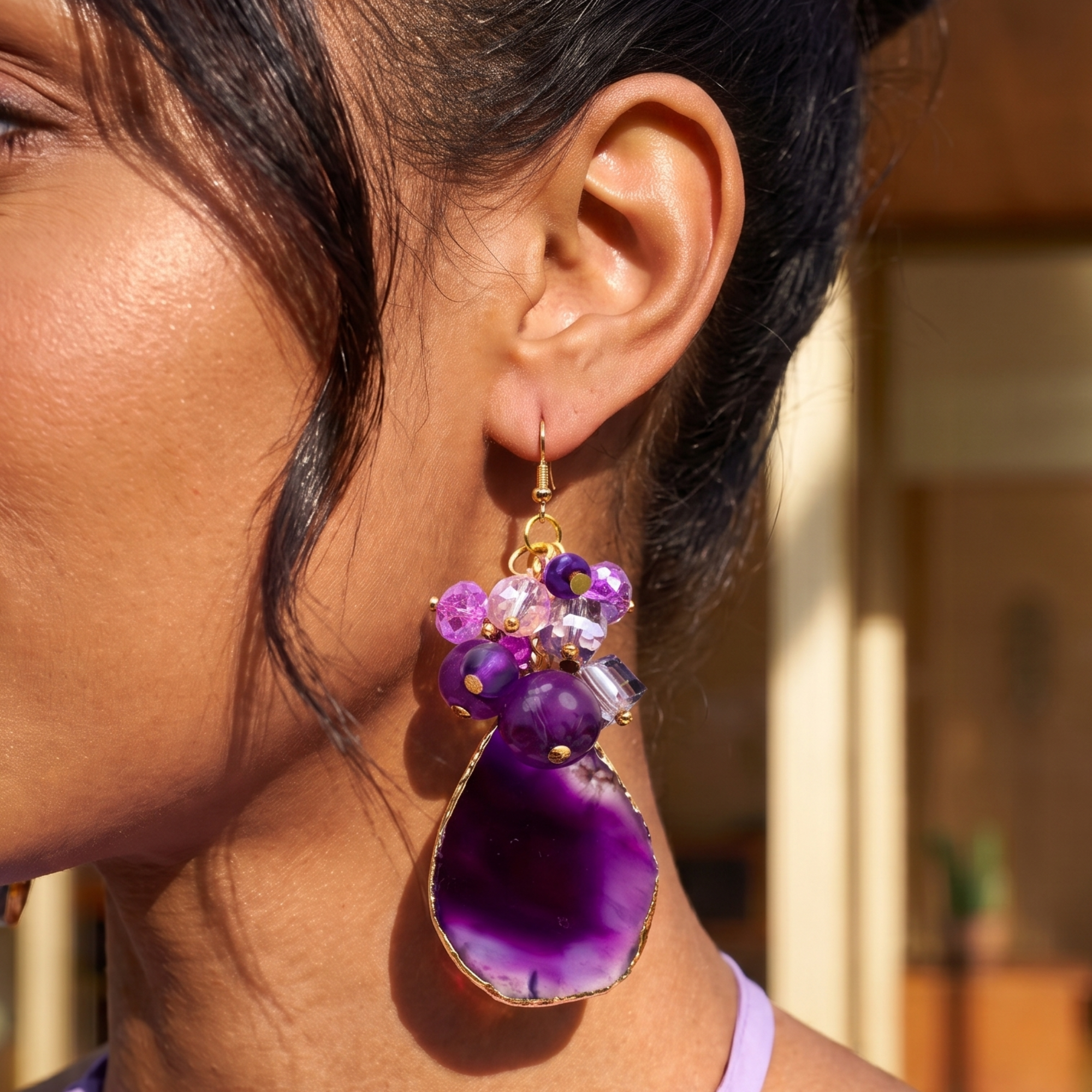 Statement dangle earrings featuring genuine purple agate slices, grape agate beads, faceted crystal accents, and gold detailing.