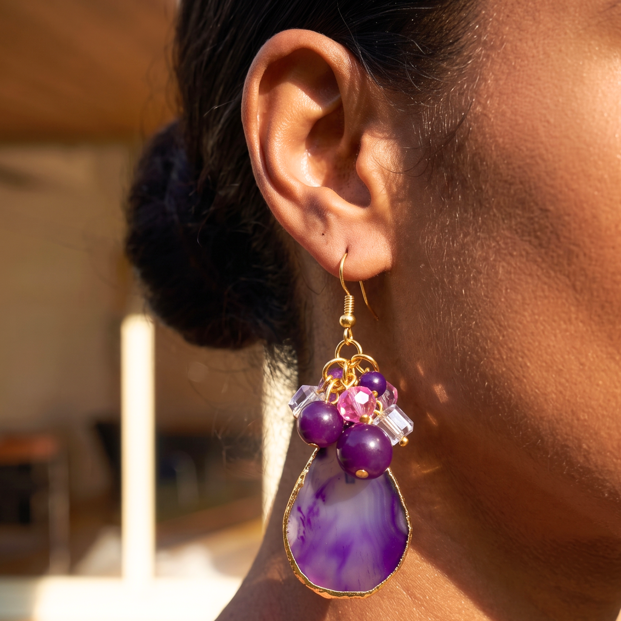 Statement dangle earrings featuring genuine purple agate slices, grape agate beads, faceted crystal accents, and gold detailing.