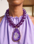 Statement necklace featuring rich grape agate beads and a natural purple druzy agate pendant edged in gold.