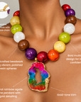 Chrysallis Joyride necklace featuring a natural rainbow agate pendant framed in shimmering gold.