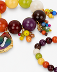 Chrysallis Joyride stretch bracelets featuring a large rainbow agate centerpiece and colorful dangling bead clusters.