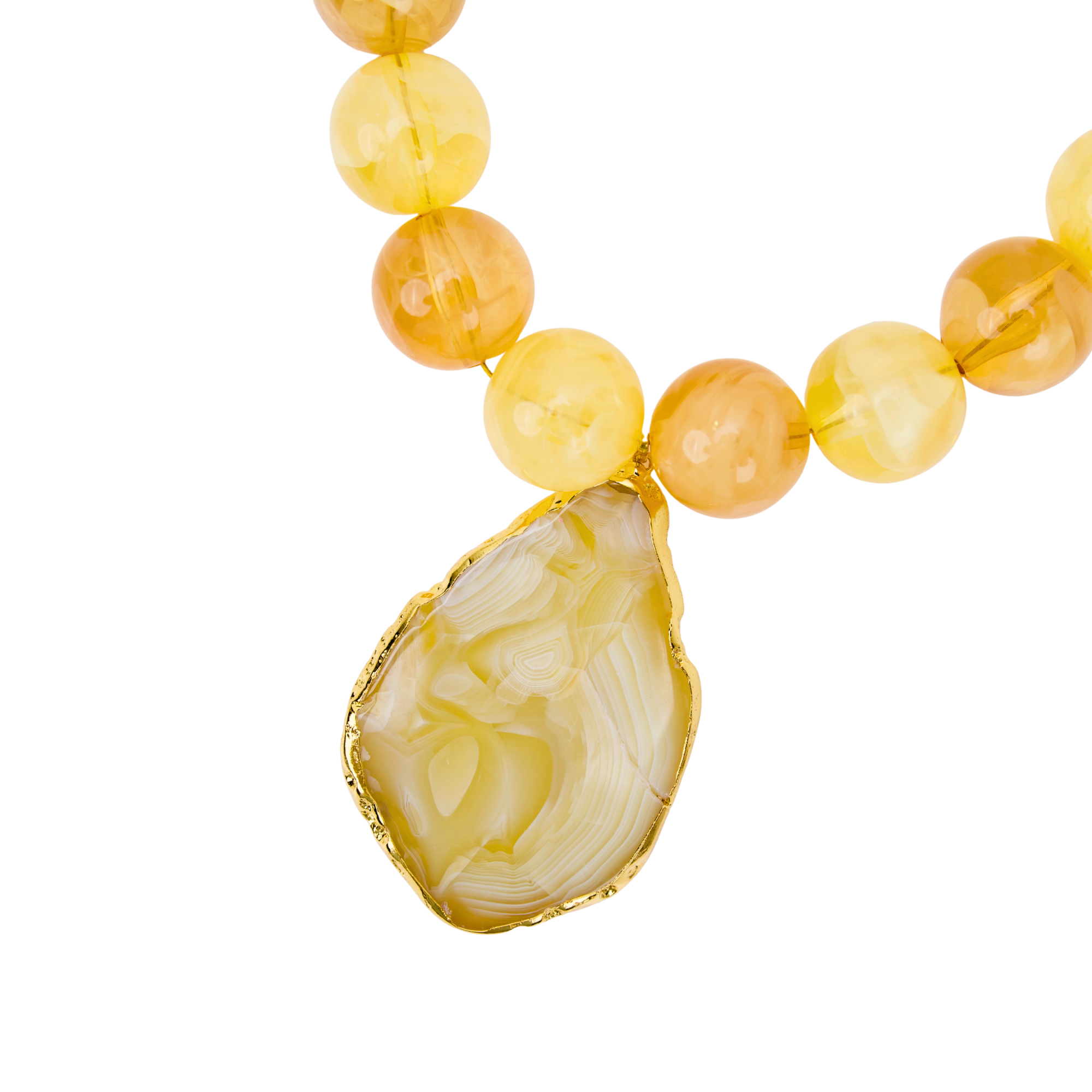 Yellow and cream marbled statement necklace featuring oversized citrus-toned beads and a natural agate pendant with gold trim by Sassy Jones.
