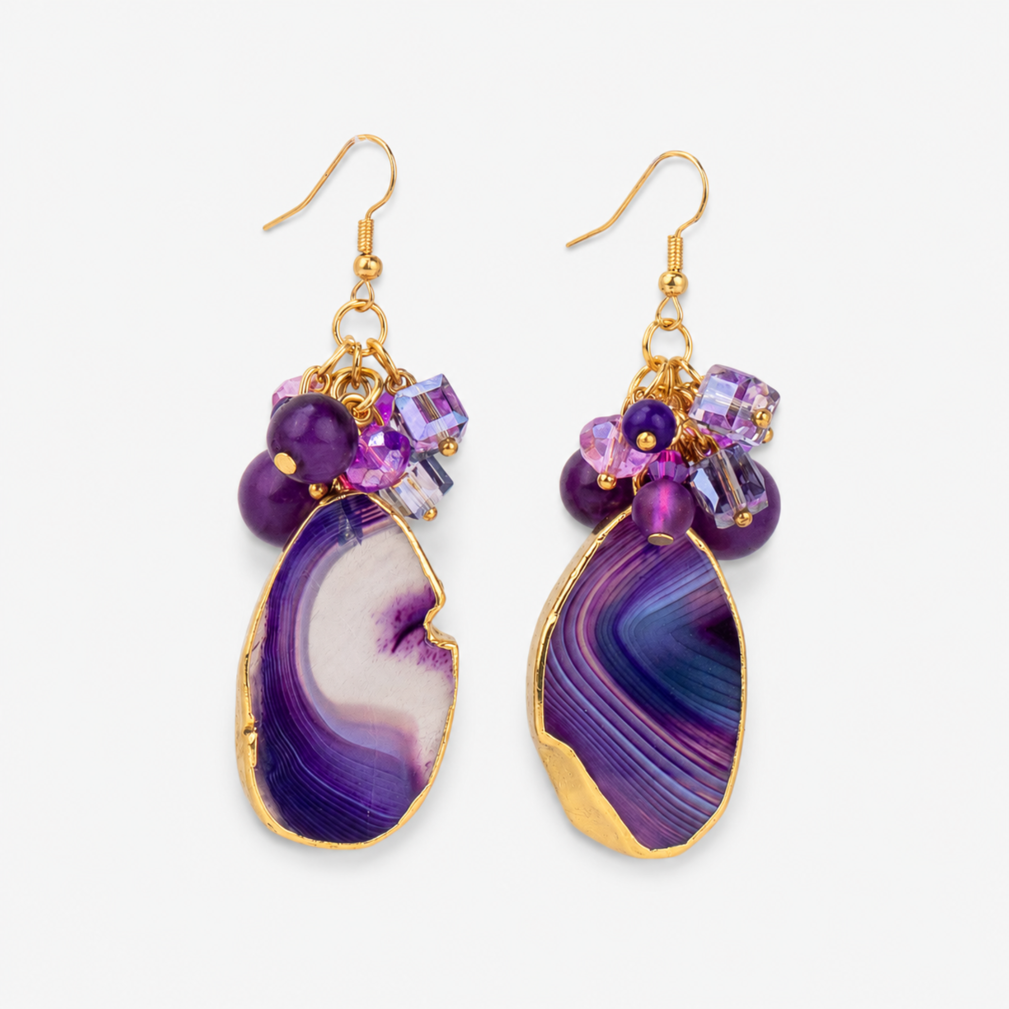 Chrysallis Natural Purple Agate dangle earrings featuring polished agate slice drops, clustered purple faceted beads and gold tone fish hook closures.