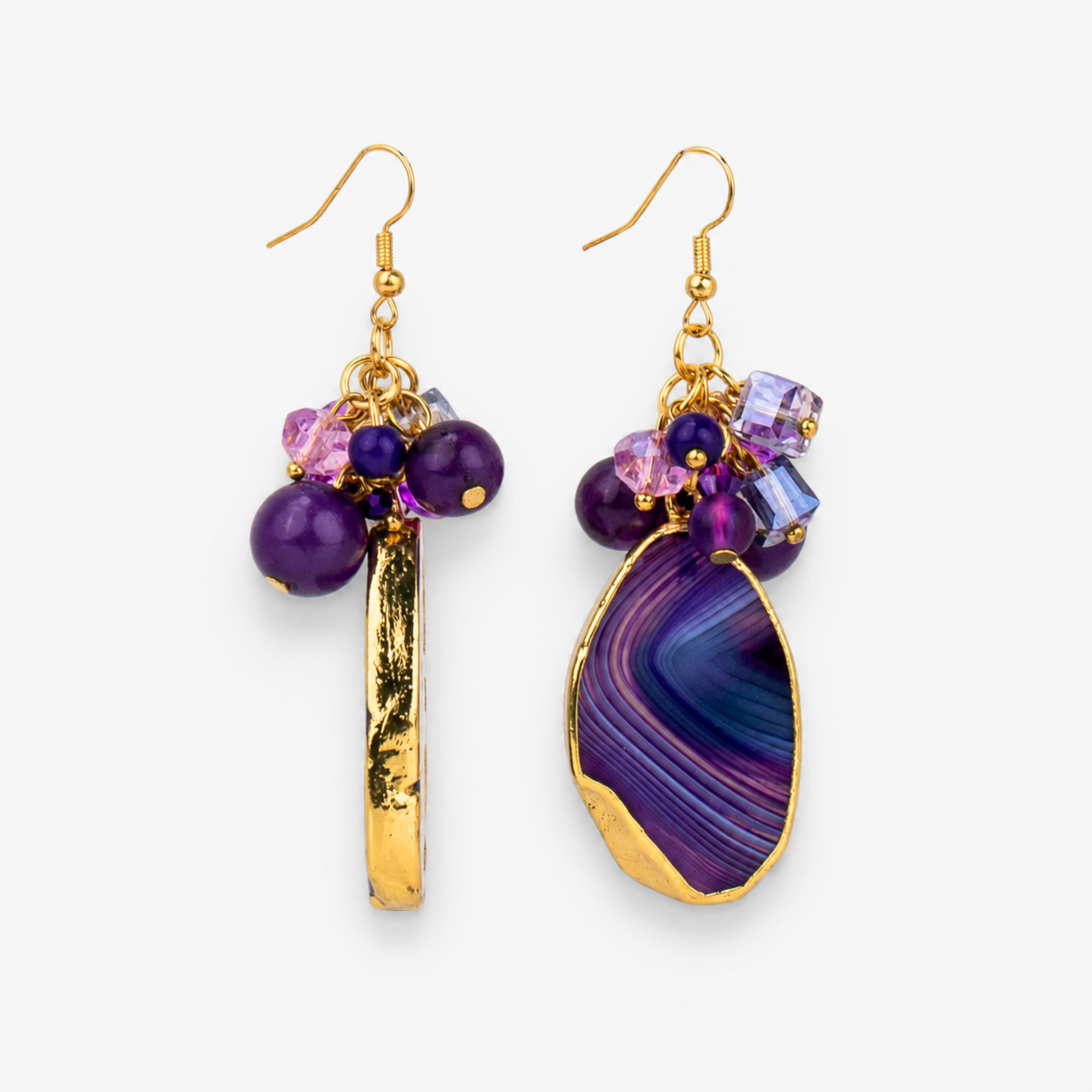 Chrysallis Natural Purple Agate dangle earrings featuring polished agate slice drops, clustered purple faceted beads and gold tone fish hook closures.