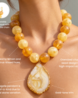 Yellow statement necklace with alternating creamy lemon and peach marbled beads and an organic agate pendant.