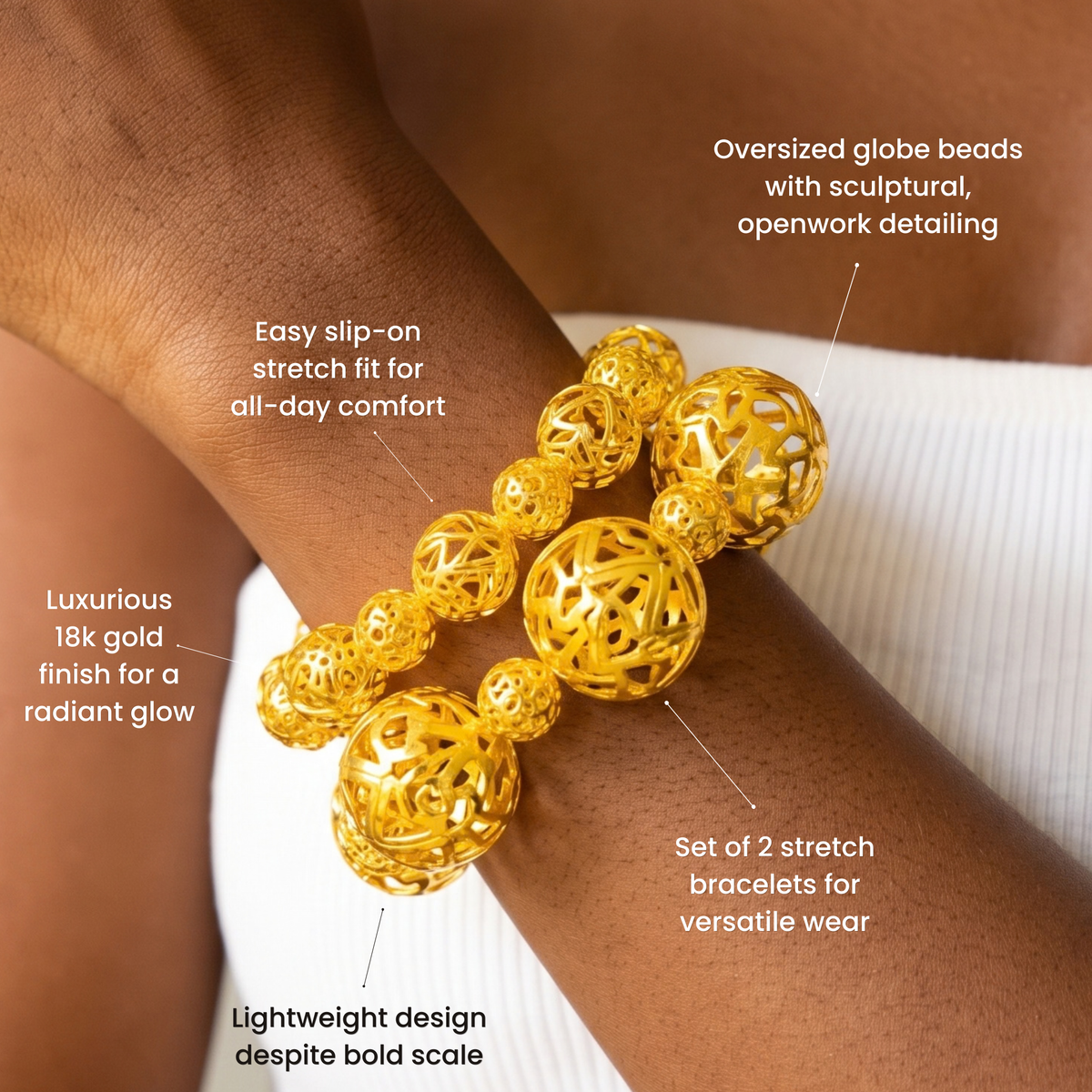 Gold statement bracelet duo featuring dimensional openwork sphere beads in mixed sizes.